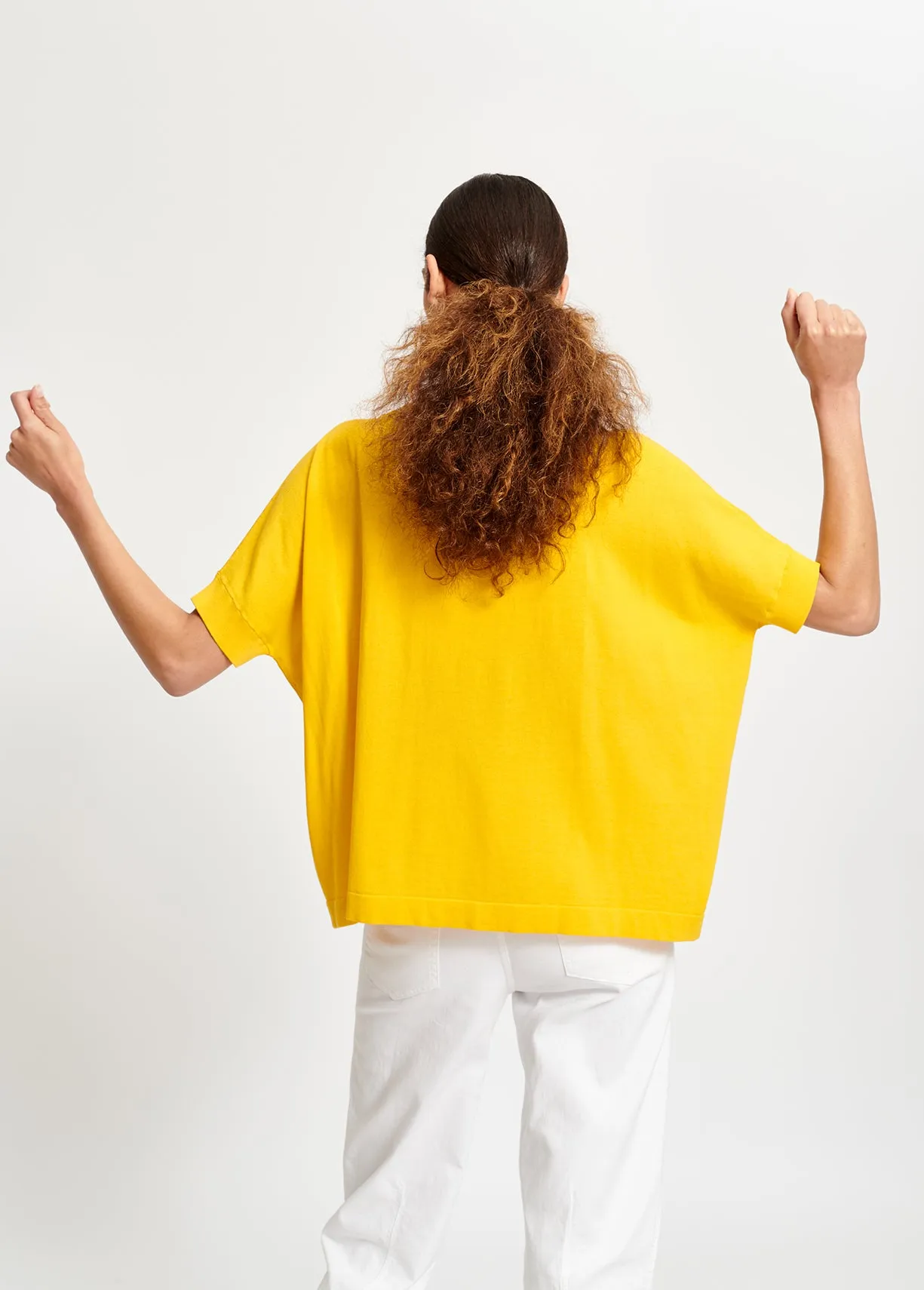 Yellow asymmetric knitted cotton sweater